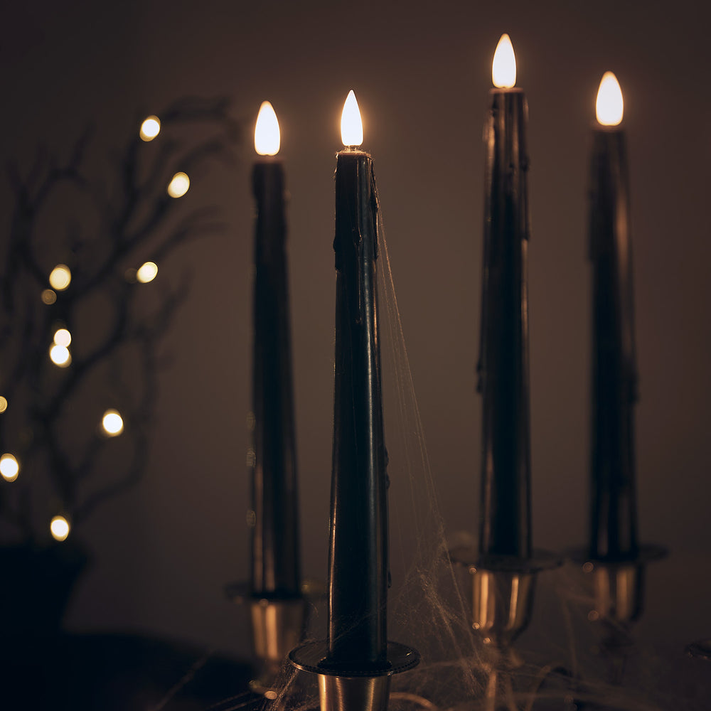 4er Set TruGlow® LED Stabkerzen Echtwachs schwarz mit Wachstropfen und Fernbedienung