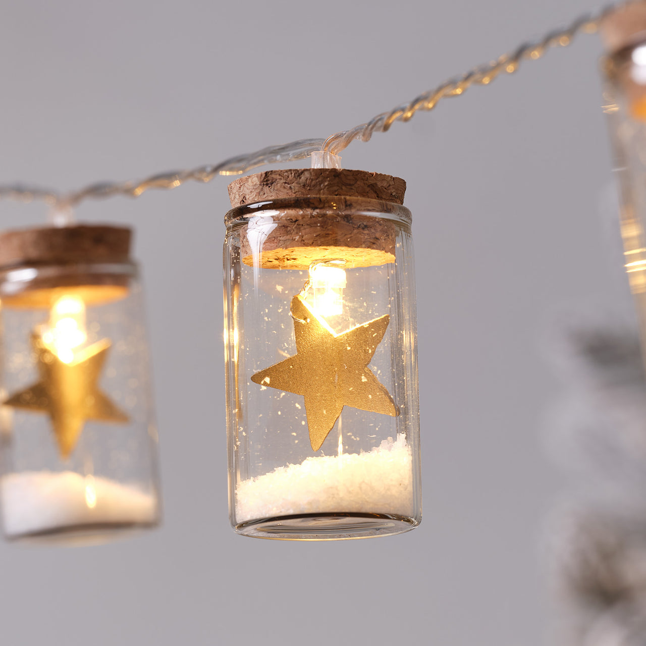 10er LED-Lichterkette Laterne mit Sternen aus Glas in Gold