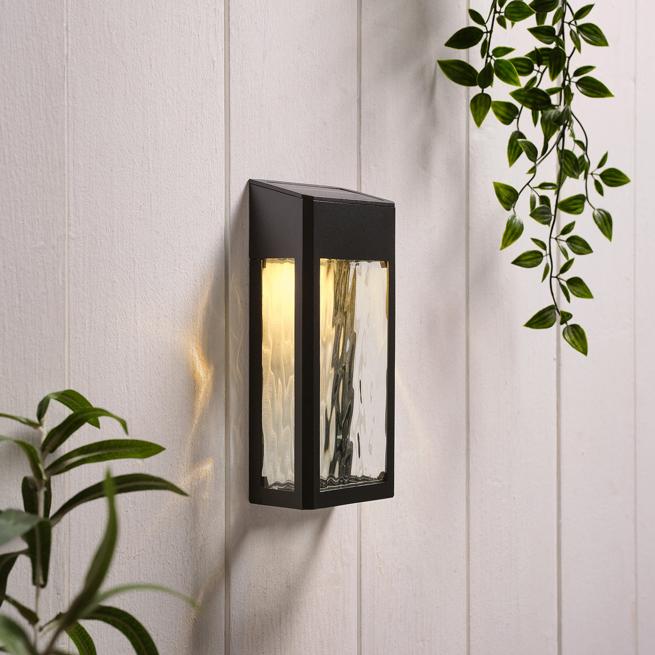 LED Solar Wandleuchte aus Glas schwarz