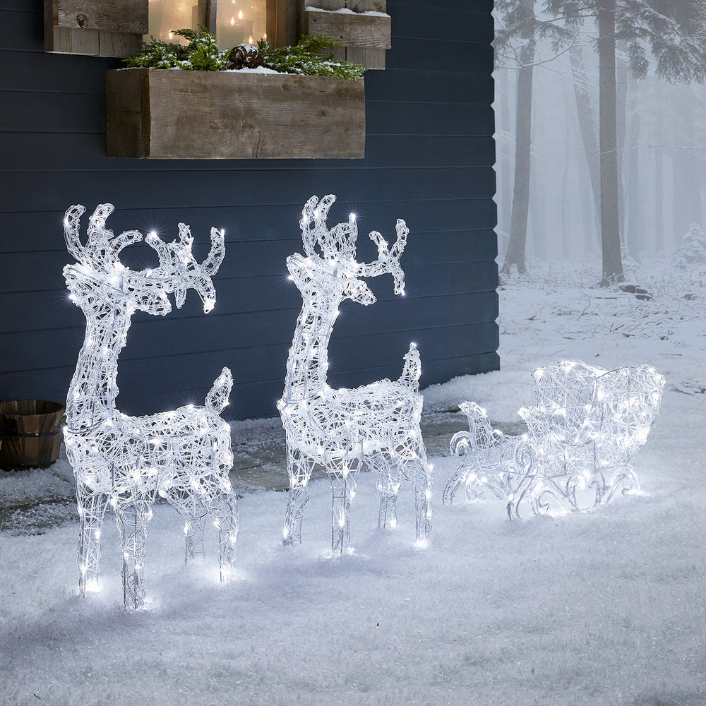 Bicolor Solar-LED-Rentiere mit Schlitten Swinsty