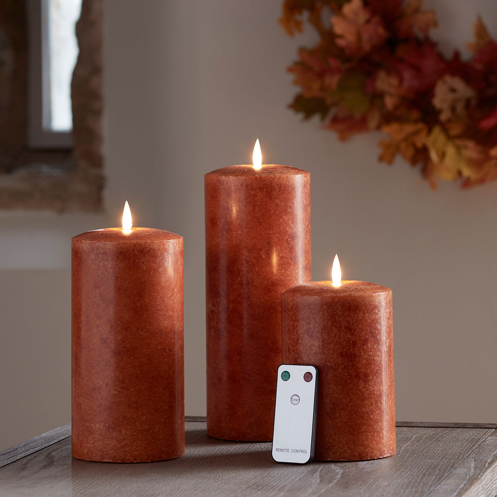 TruGlow® LED Kerzen Echtwachs Trio orange Ø 10cm mit Fernbedienung