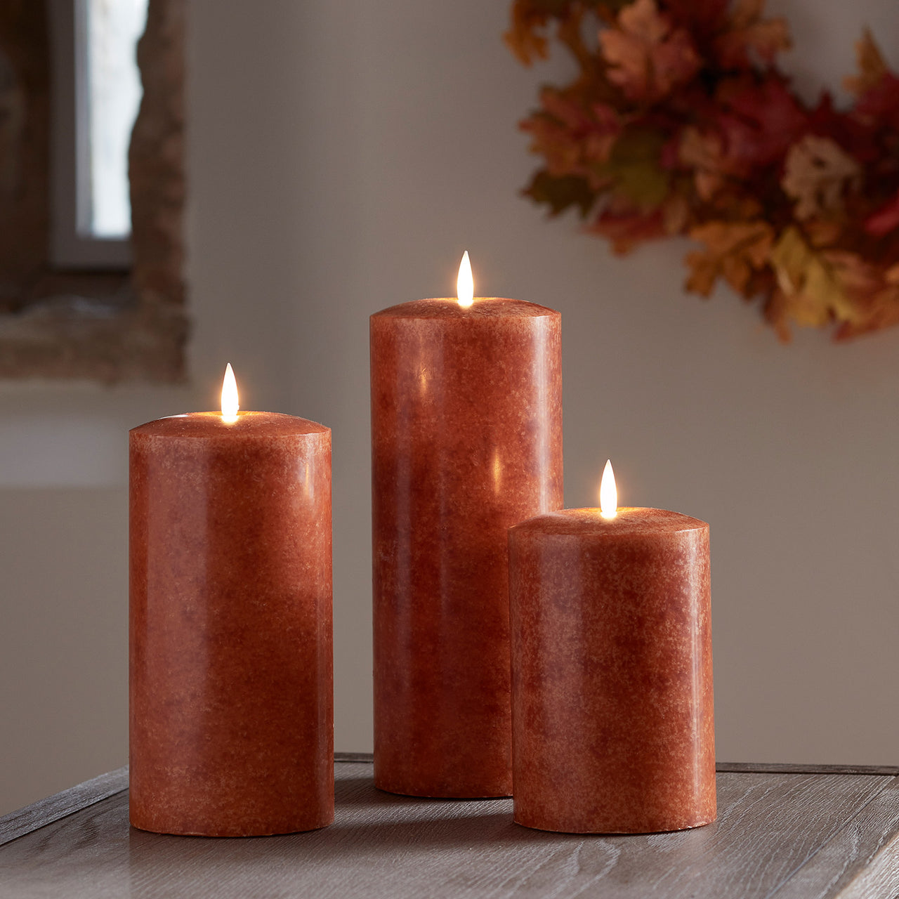 TruGlow® LED Kerzen Echtwachs Trio orange Ø 10cm mit Fernbedienung