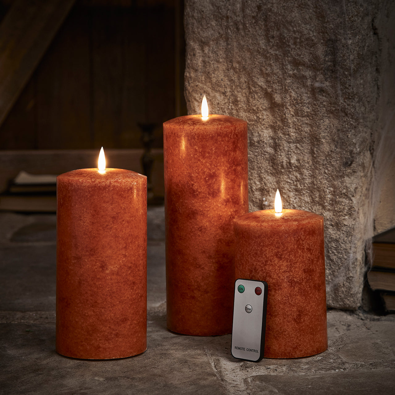 TruGlow® LED Kerzen Echtwachs Trio orange Ø 10cm mit Fernbedienung