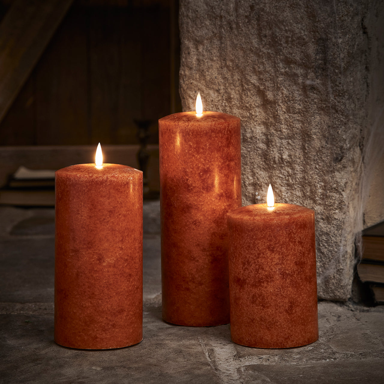 TruGlow® LED Kerzen Echtwachs Trio orange Ø 10cm mit Fernbedienung